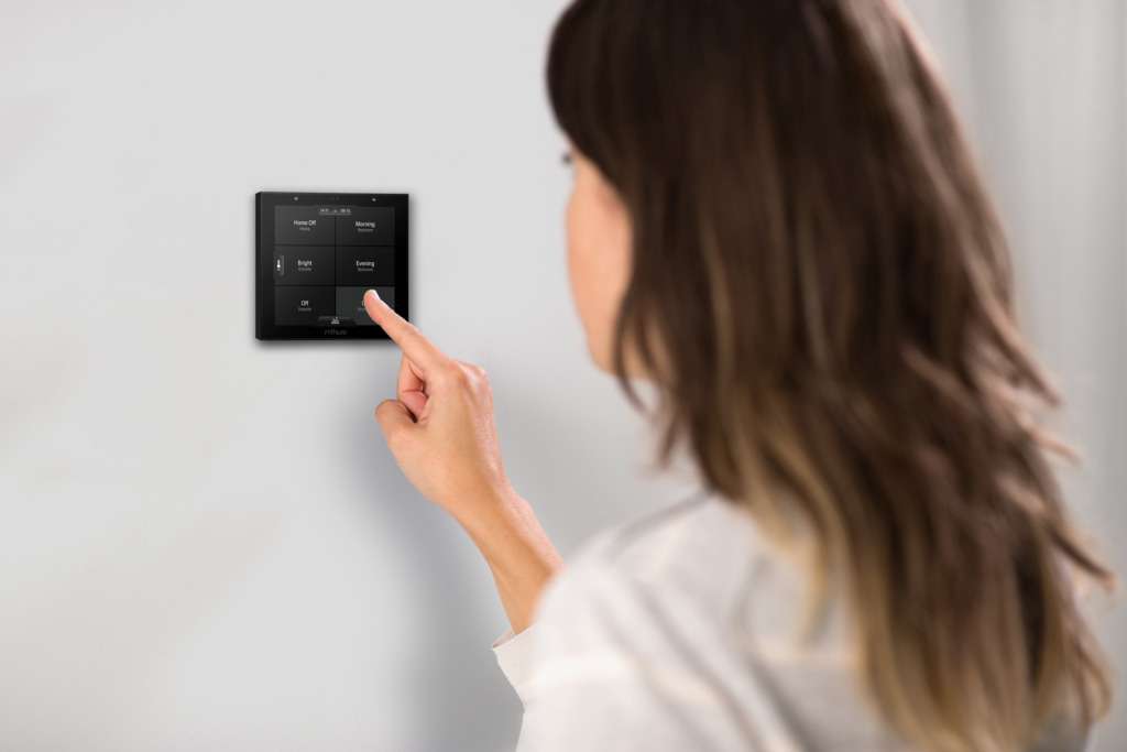 Woman pressing Rithum Switch