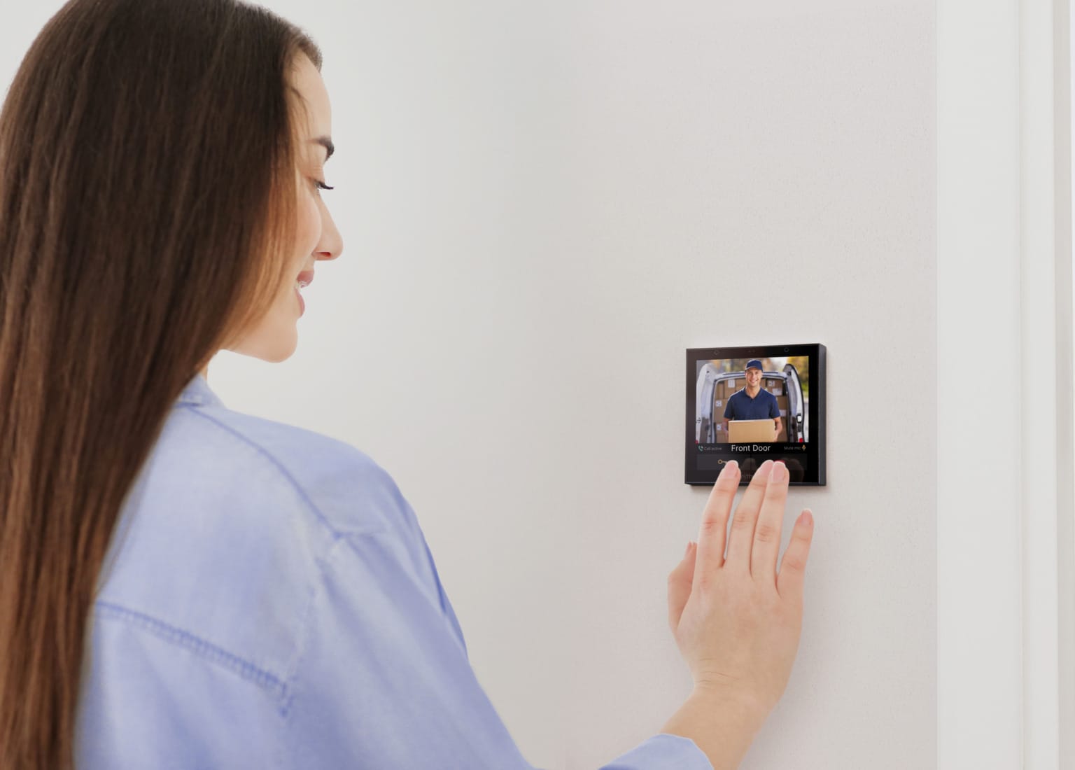 Woman using Rithum Switch Pro Video Intercom