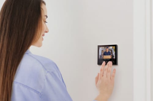 Woman using Rithum Switch Pro Video Intercom