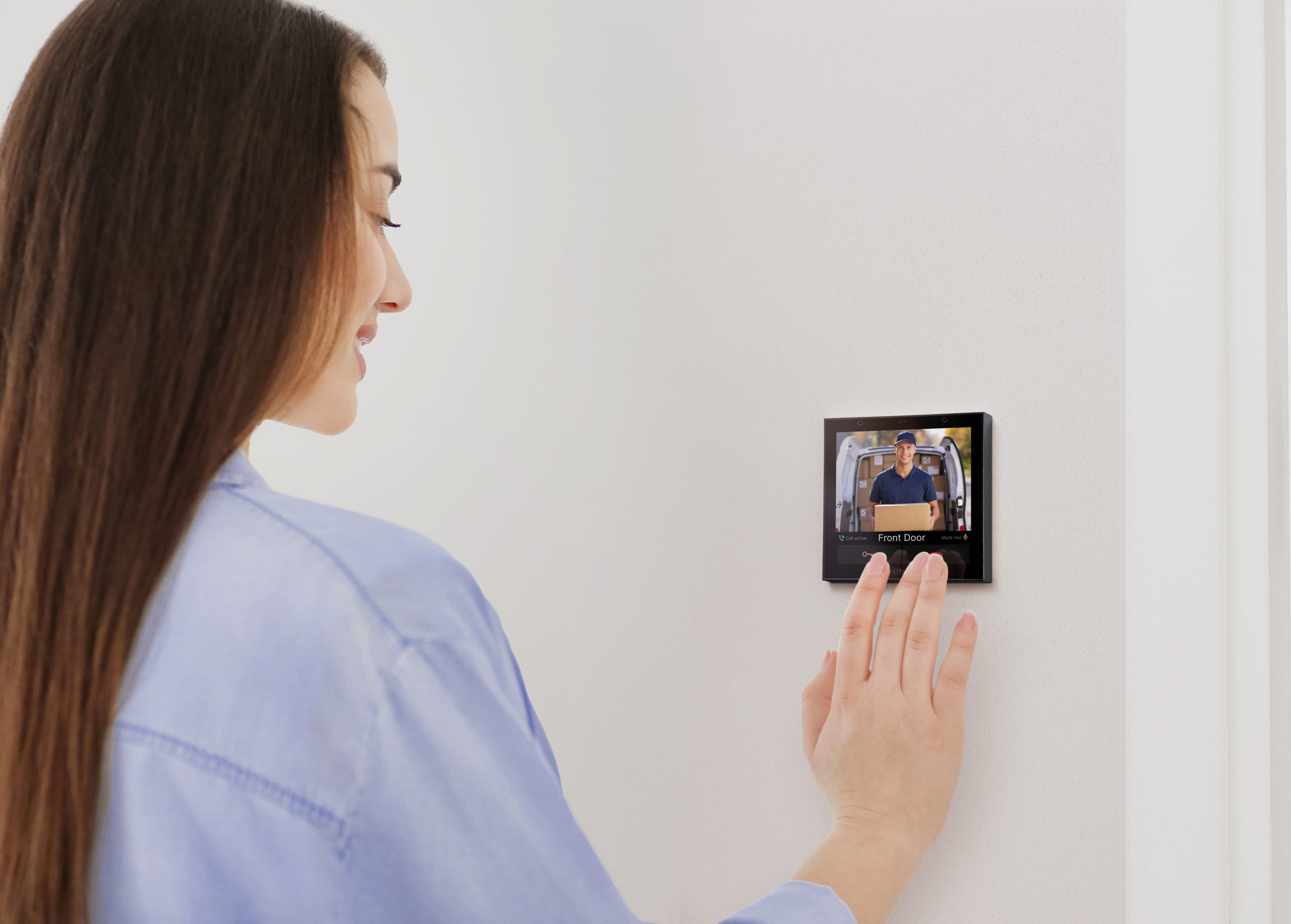Woman using Rithum Switch Pro Video Intercom