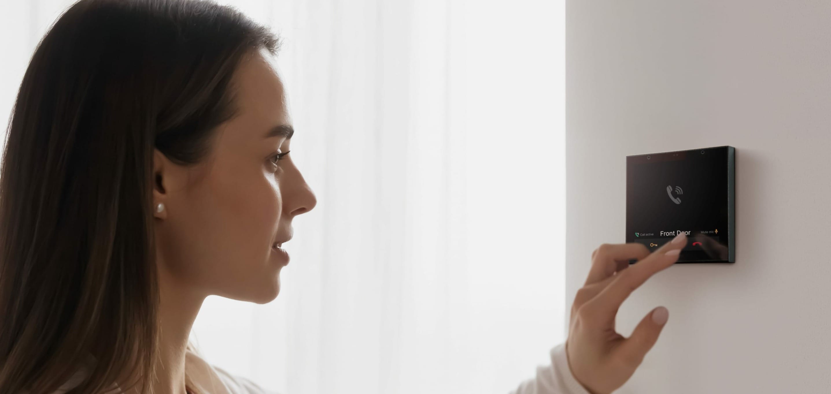 Woman using Rithum Switch Pro Audio Intercom